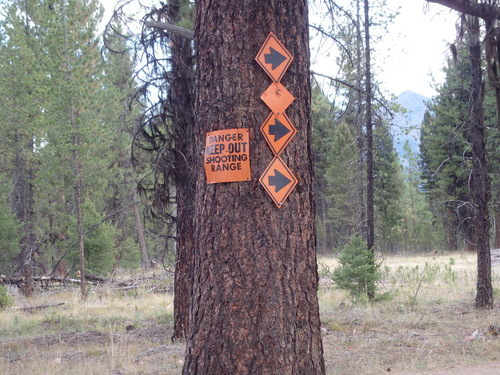 GDMBR: Orange Direction signs for the Winter Snowmobile Route.